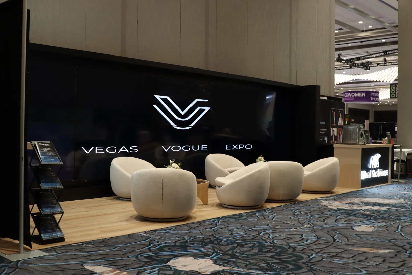 Vegas Vogue Expo branded lounge with sculpted seating in a booth we built at Caesars Forum