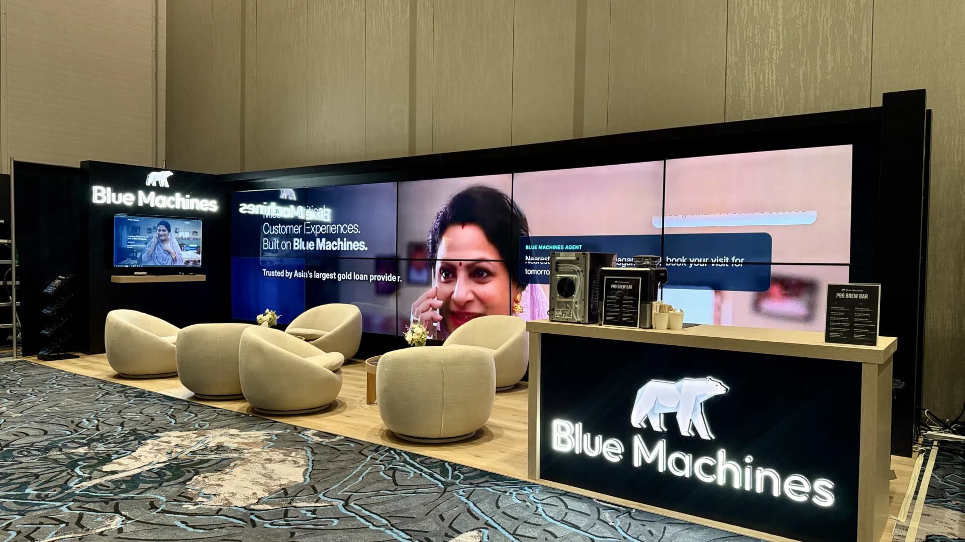 Full-width video wall and conversation lounge on a large Las Vegas trade show island